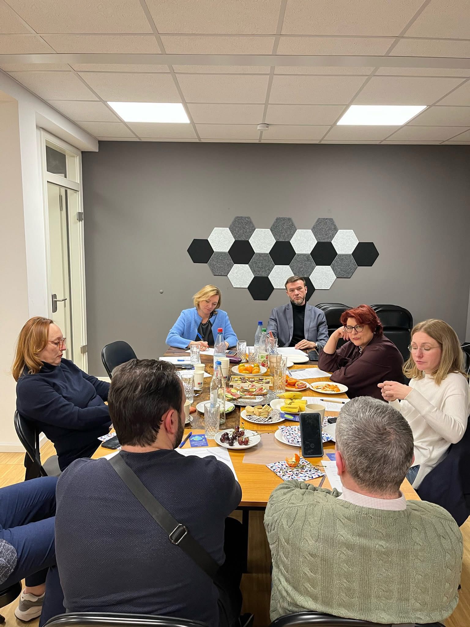 People in conversation at a modern business gathering